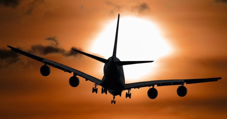 Flights - Shadow Image of a Plane Flying during Sunset