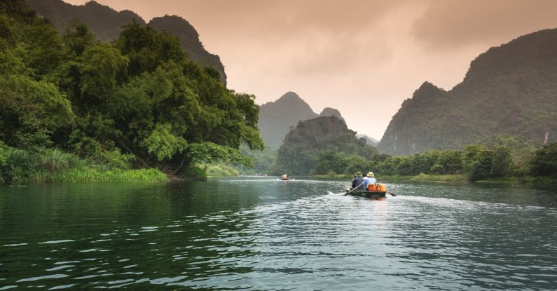 Tours - People Riding a Boat