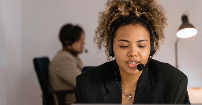 Operator - Woman in Black Blazer Sitting on Chair