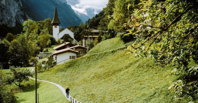 Swiss Alps - Person Walking on Pathway