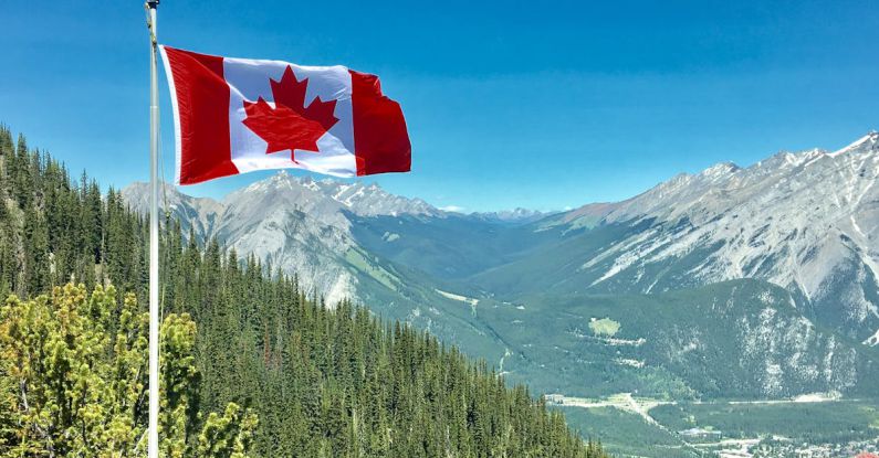 Canada - Canada Flag With Mountain Range View