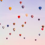 a-group-of-hot-air-balloons-flying-in-the-sky