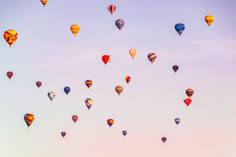 a-group-of-hot-air-balloons-flying-in-the-sky